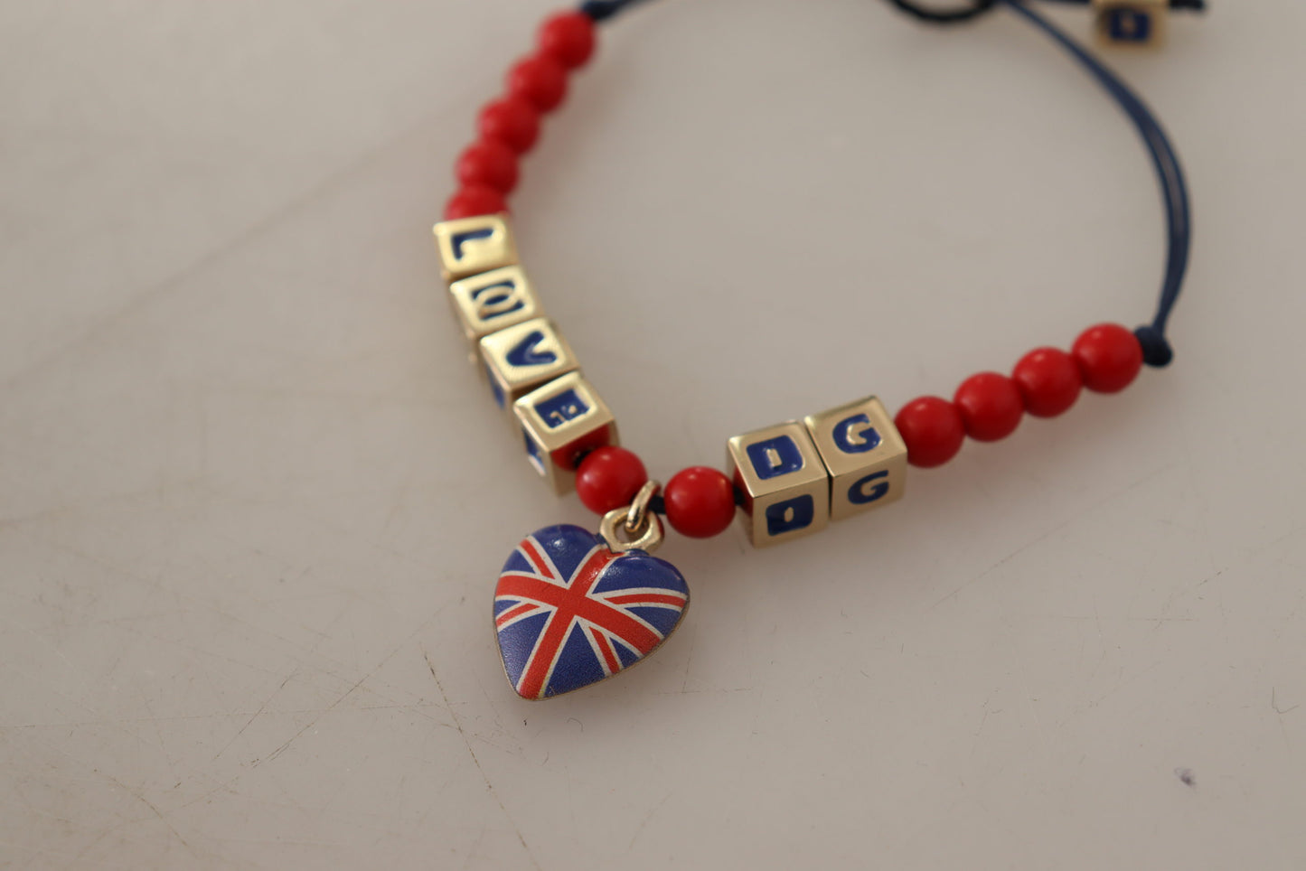 Dolce & Gabbana Elegante bracciale in vetro blu, rosso e zama