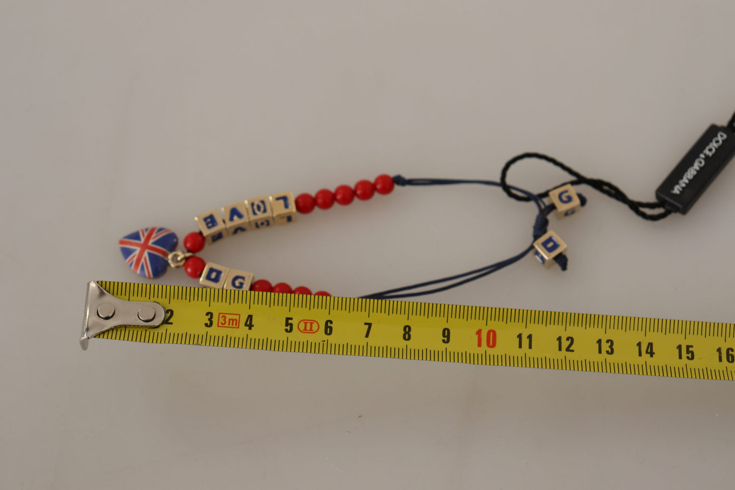 Dolce & Gabbana Elegante bracciale in vetro blu, rosso e zama