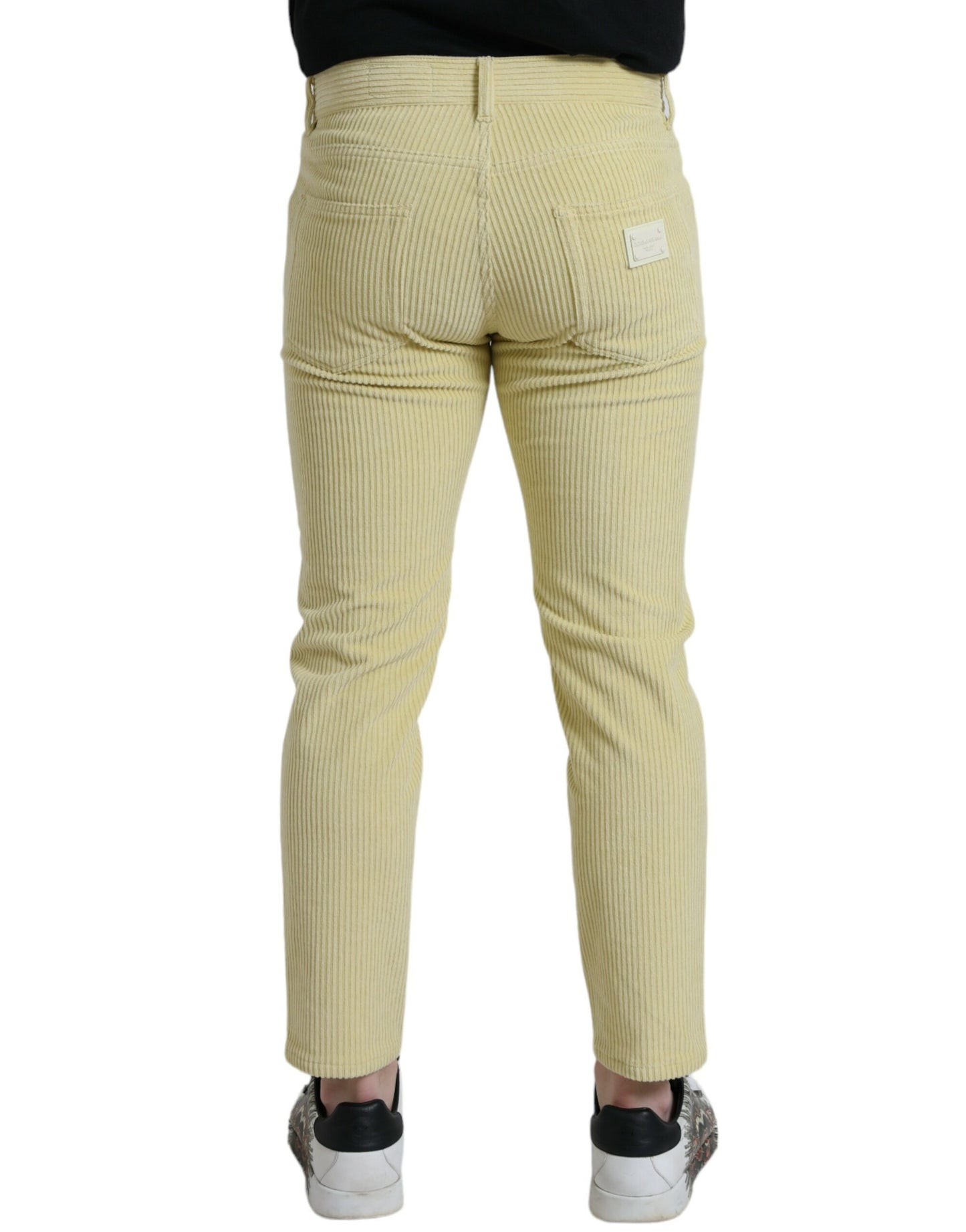 Jeans skinny in denim skinny con placca con logo in velluto a coste giallo Dolce & Gabbana