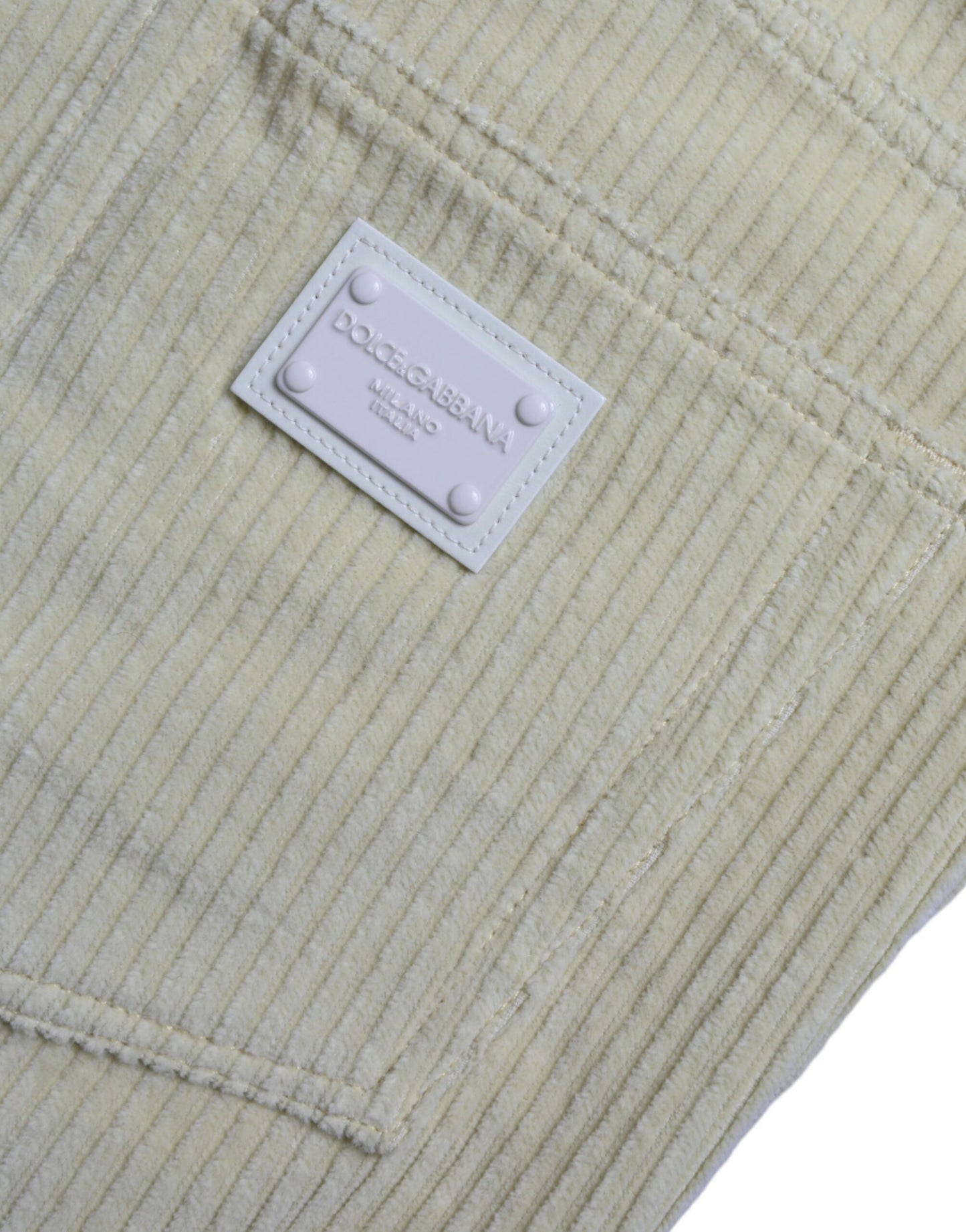 Jeans skinny in denim skinny con placca con logo in velluto a coste giallo Dolce & Gabbana
