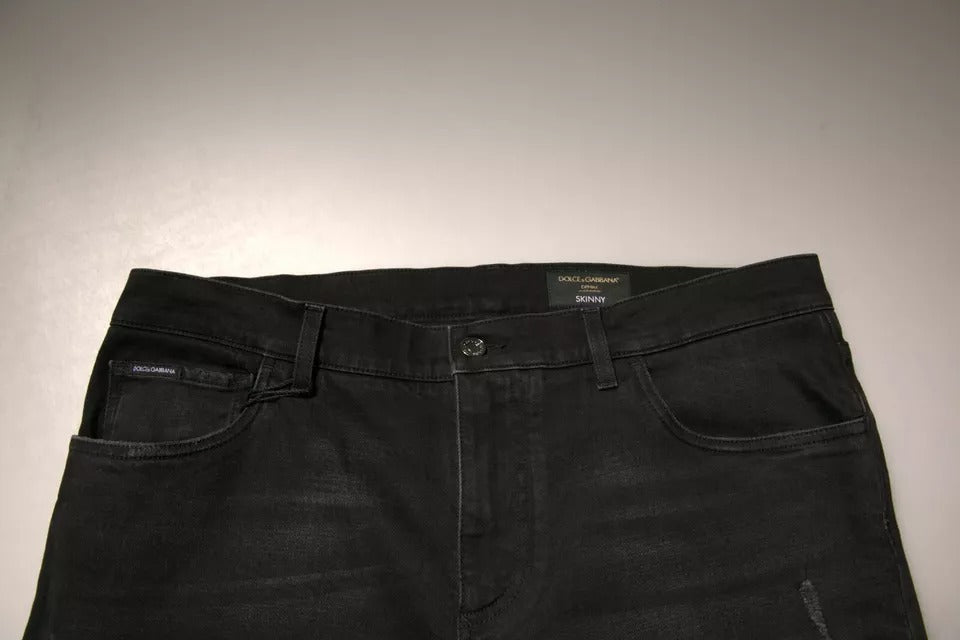Jeans aderenti in denim di cotone con logo strappato nero Dolce & Gabbana