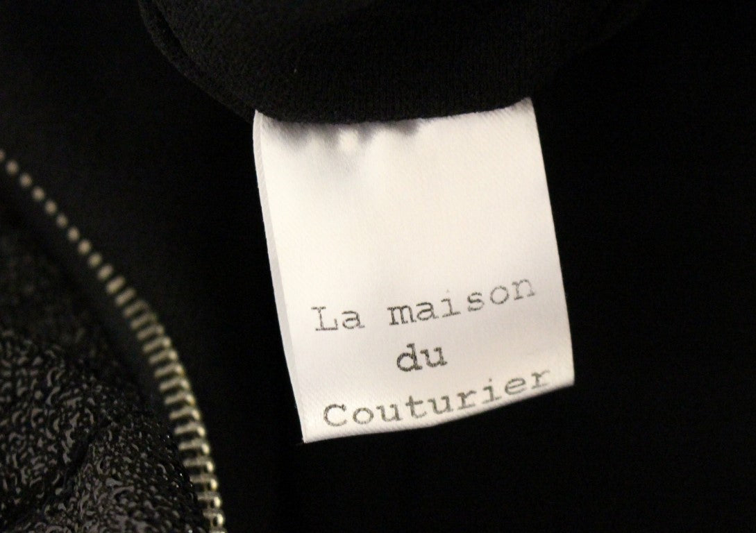 La Maison du Couturier Elegante tuta in pelle nera con cinturino in vita