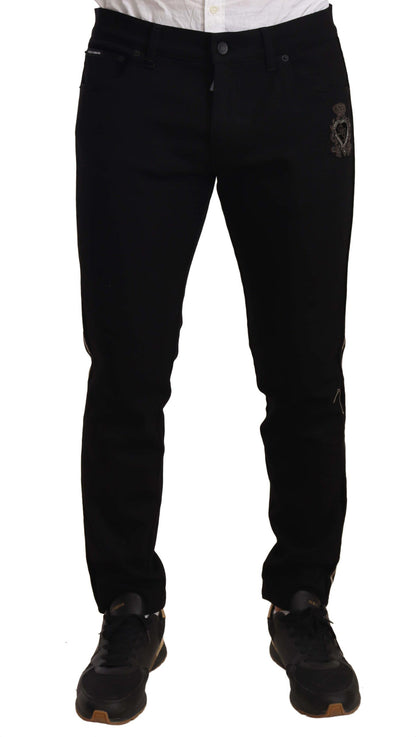 Jeans neri slim fit con ricamo araldico Dolce &amp; Gabbana