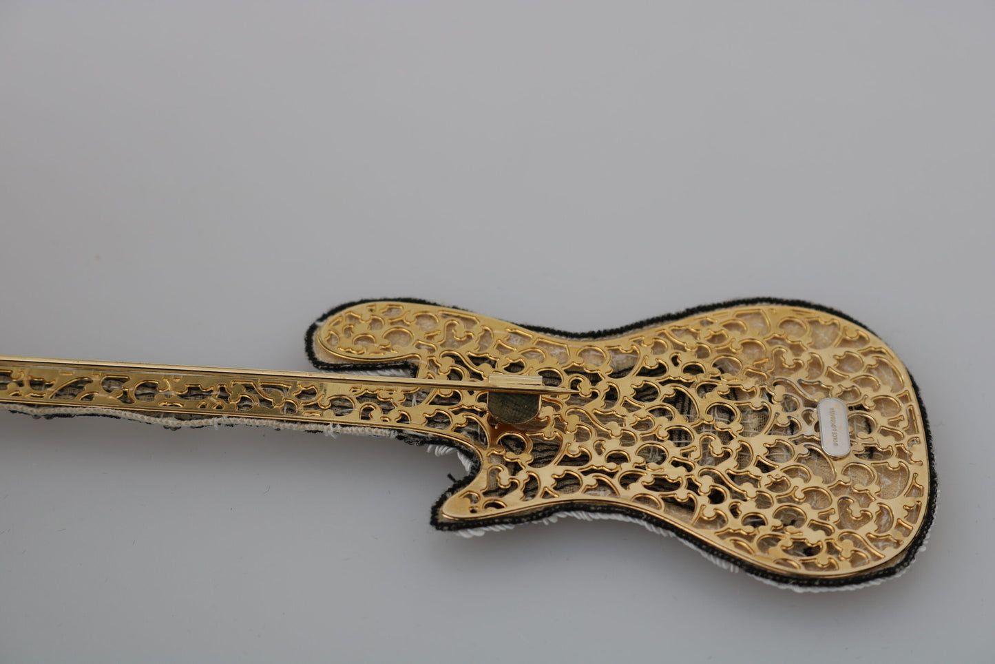 Spilla a forma di chitarra con paillettes dorate Dolce &amp; Gabbana