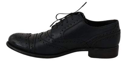 Dolce &amp; Gabbana eleganti scarpe derby con punta alare in pelle blu